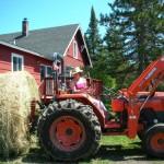 She makes my tractor sexy... Kat hauls a huge round bale with Excalibur