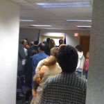 The 40 immigrants listen to welcoming speech