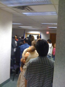 The 40 immigrants listen to welcoming speech