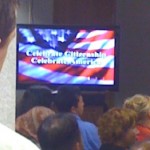 Video screen welcoming new American citizens